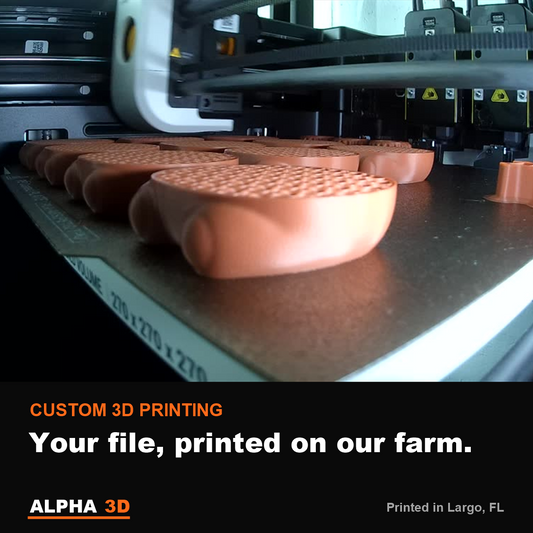 A batch of custom 3D printed parts on a print bed at the Alpha 3D print farm in Largo, FL